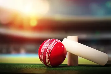 A man celebrating a winning moment on his laptop while gaming symbols float around him, capturing the excitement of GK222 games.