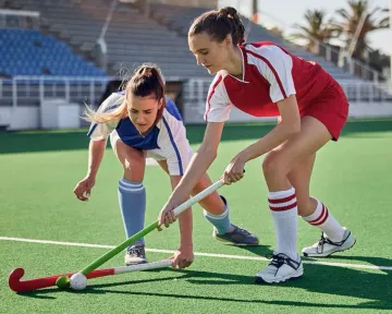 A man celebrating a winning moment on his laptop while gaming symbols float around him, capturing the excitement of GK222 games.